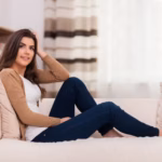 Attractive woman relaxing sofa